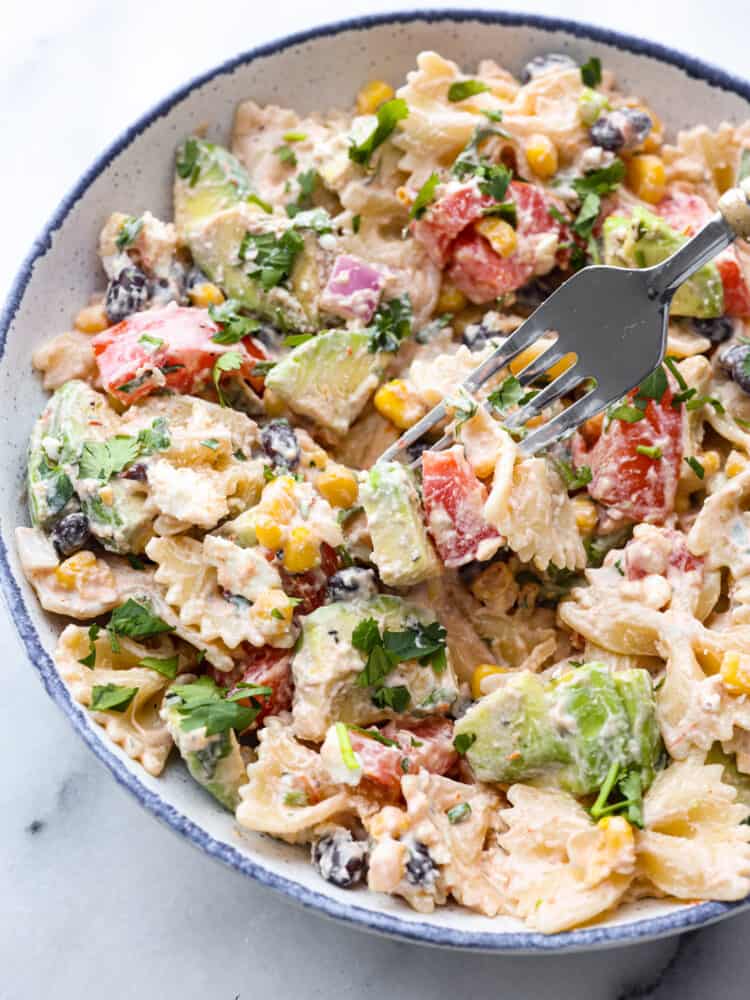 Mexican pasta salad in a bowl with a fork. 