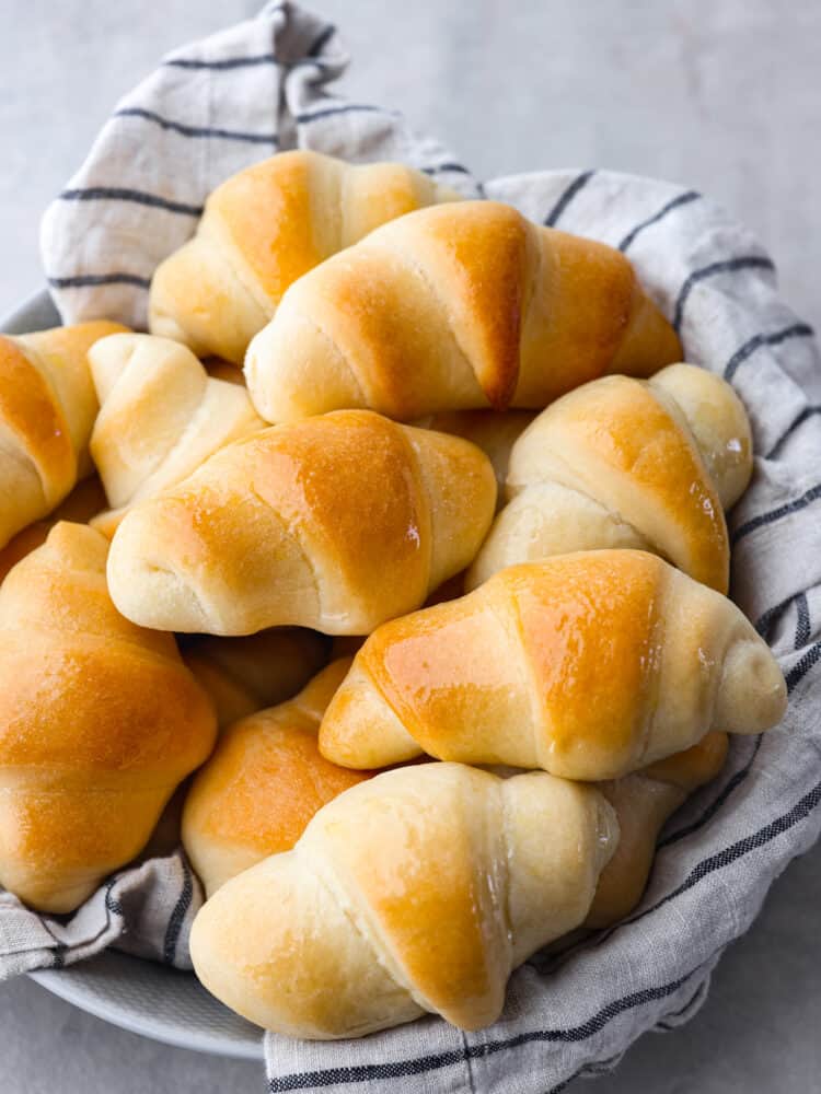 The top view of a bowl of crescent rolls. 