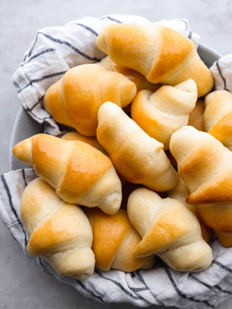 A bowl of baked crescent rolls. 