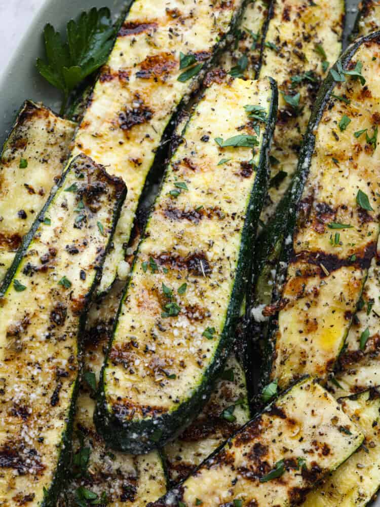 A closeup of grilled zucchini spears. 