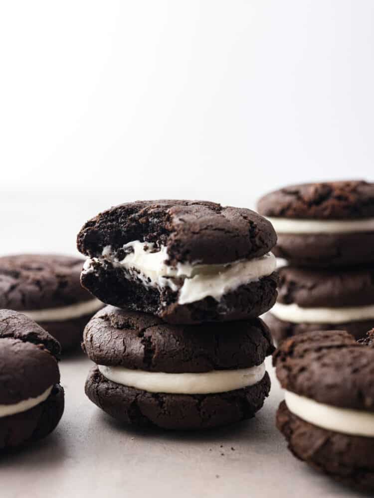 A stack of oreo cakesters with a bite taken out of the top one. 