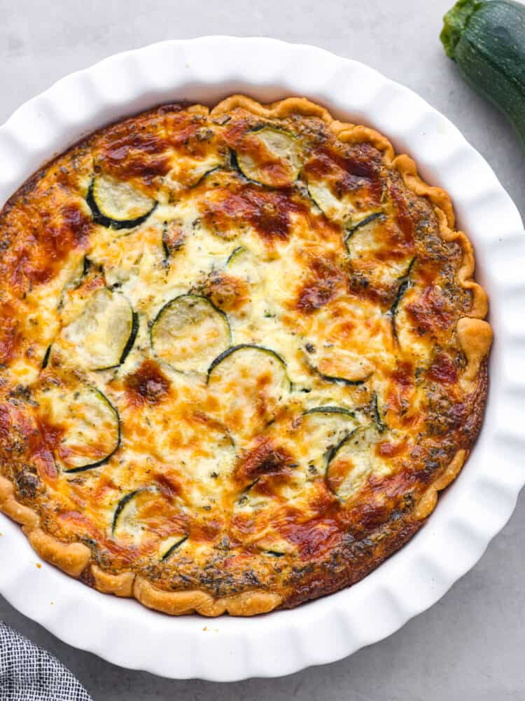 The top view of a baked zucchini quiche. 