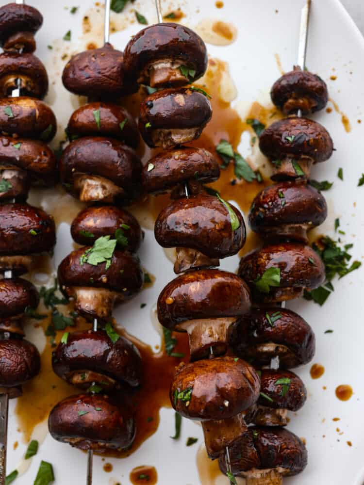 A close-up of grilled honey soy mushroom skewers. 