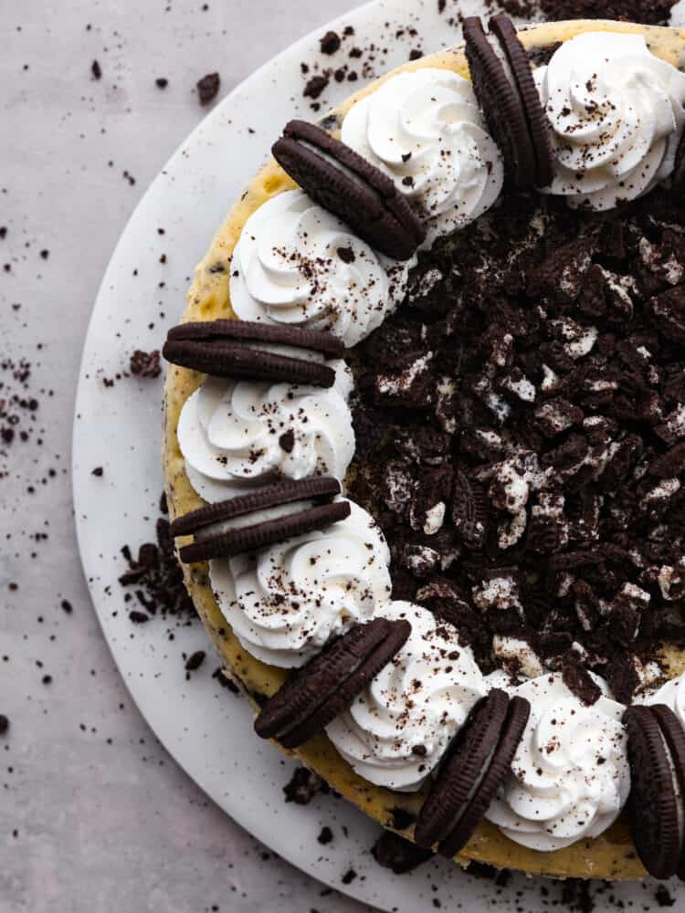 The top view of half of an oreo cheesecake on a platter. 