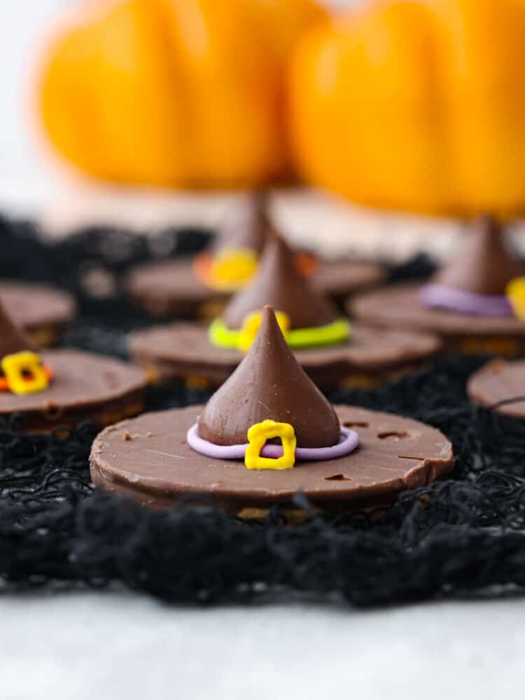 Closeup of a witch hat made with a chocolate cookie and Hershey's Kiss.