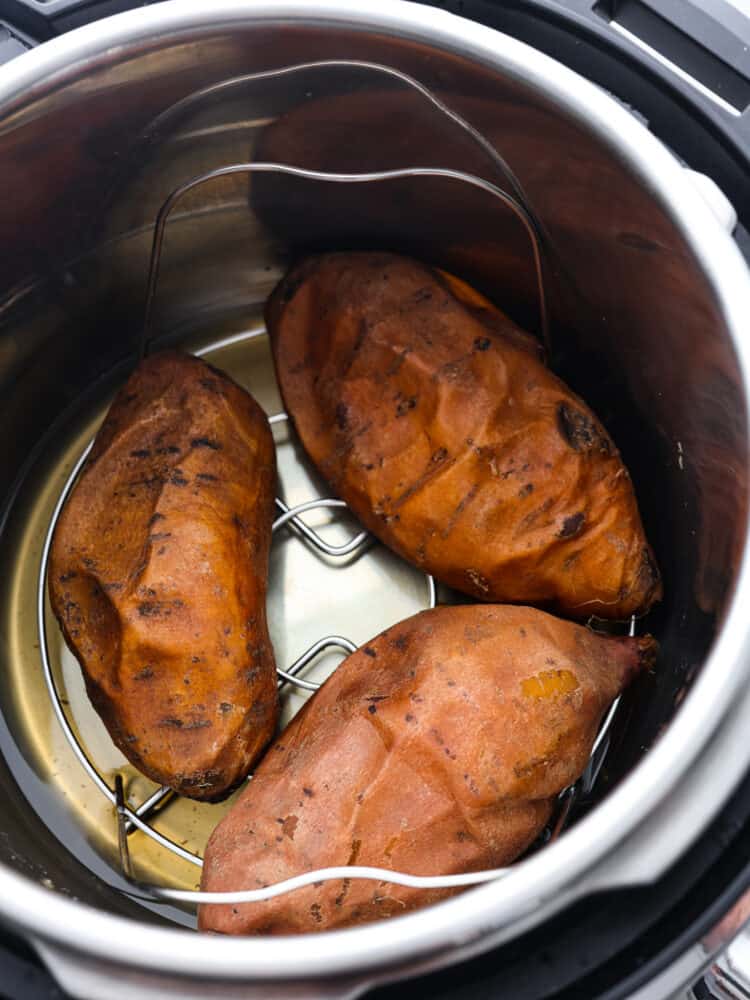 3 cooked sweet potatoes in the base of an Instant Pot.