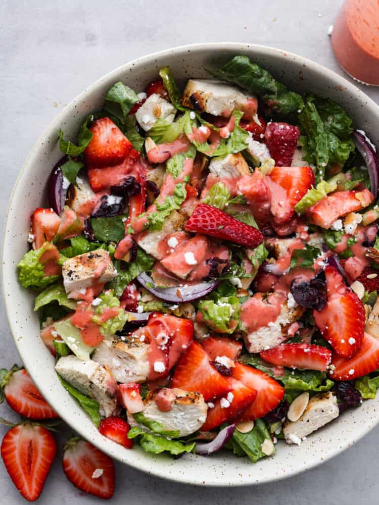 The top view of a bowl of strawberry chicken salad with strawberry balsamic dressing. 