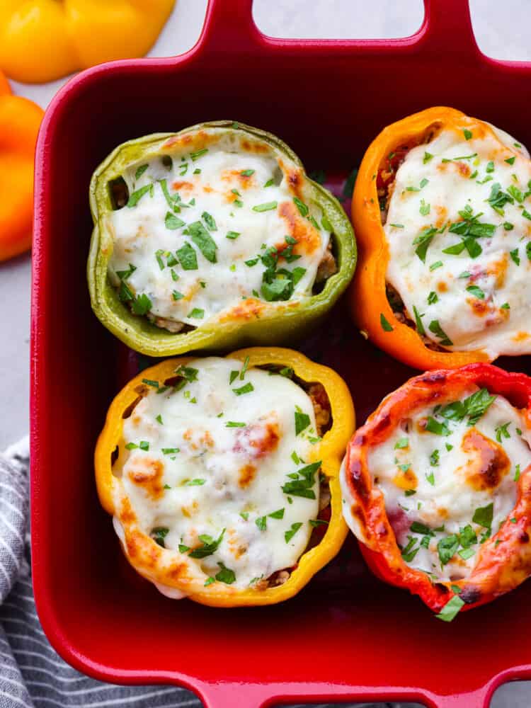 Closeup of 4 turkey and cheese stuffed peppers.