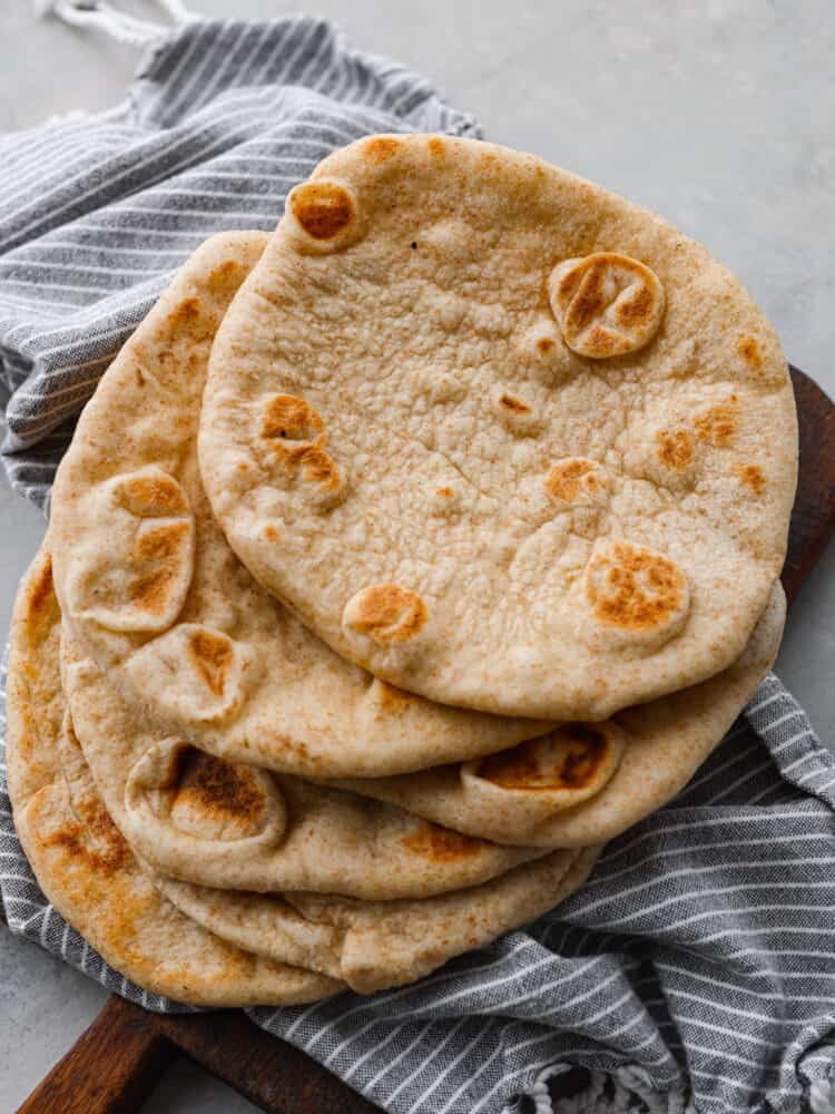 The top view of a stack of pita bread. 