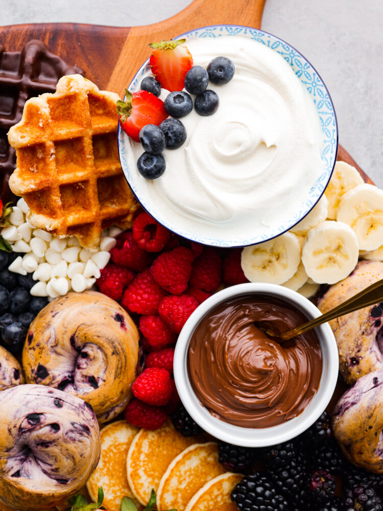 Close up of whipped cream, Nutella, and fruit.