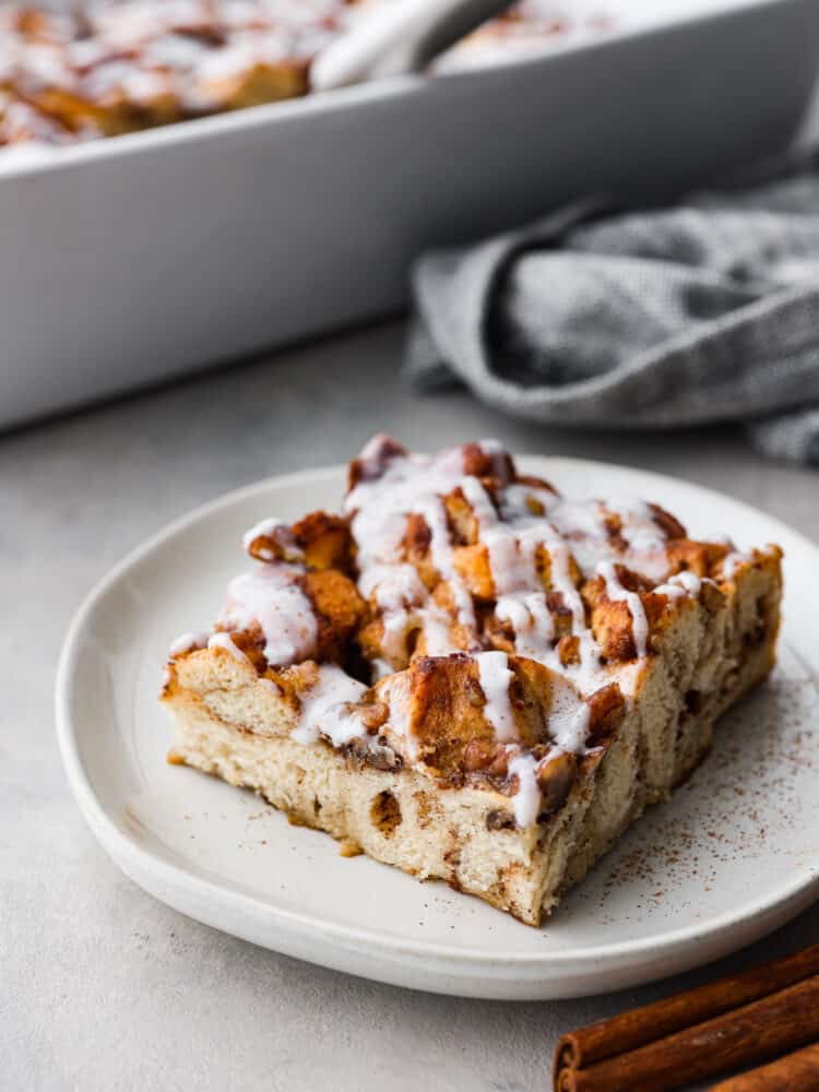 A slice of cinnamon French toast bake on a white plate. 
