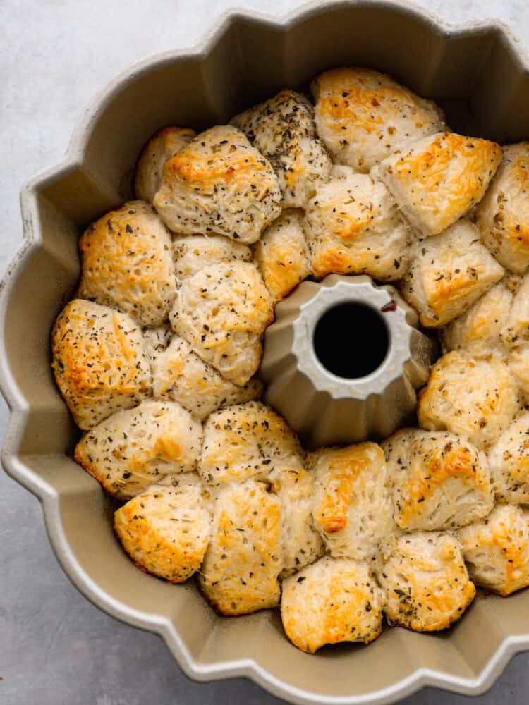 Top-down view of baked rolls in a bundt pan.