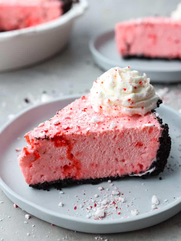 A slice of peppermint pie on a gray plate. 