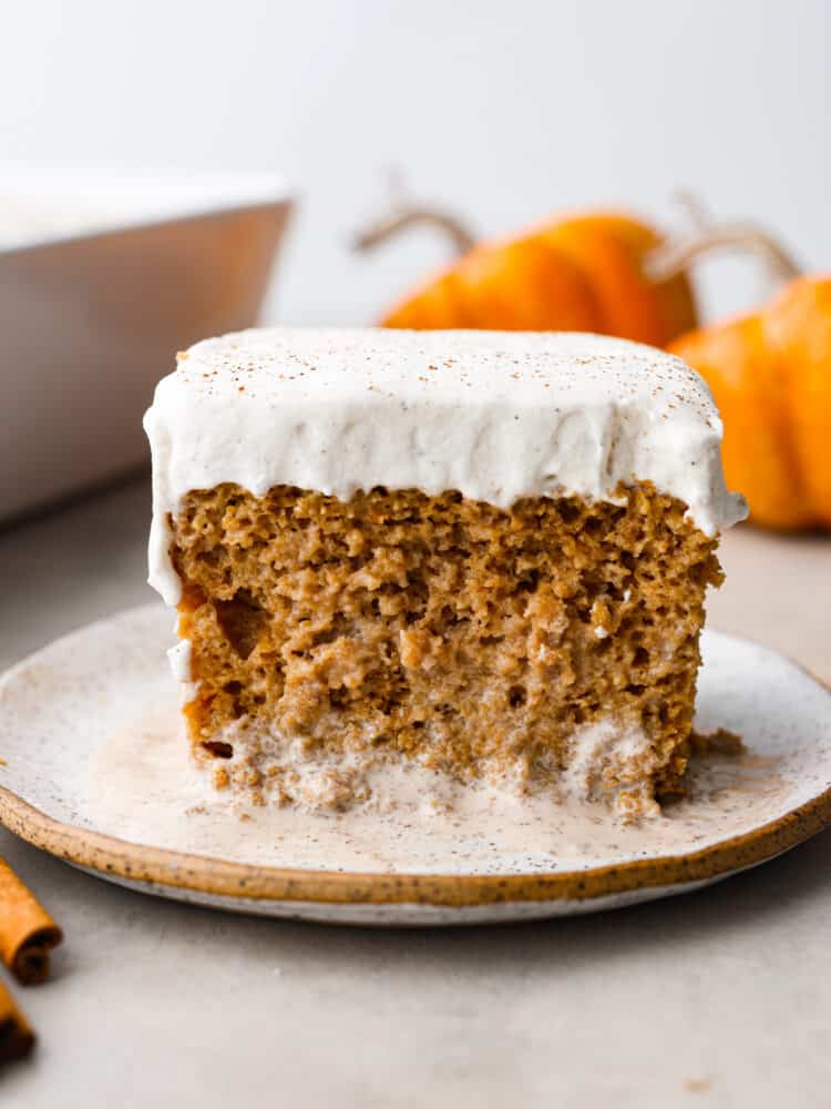 Closeup of pumpkin tres leches on a stoneware plate.