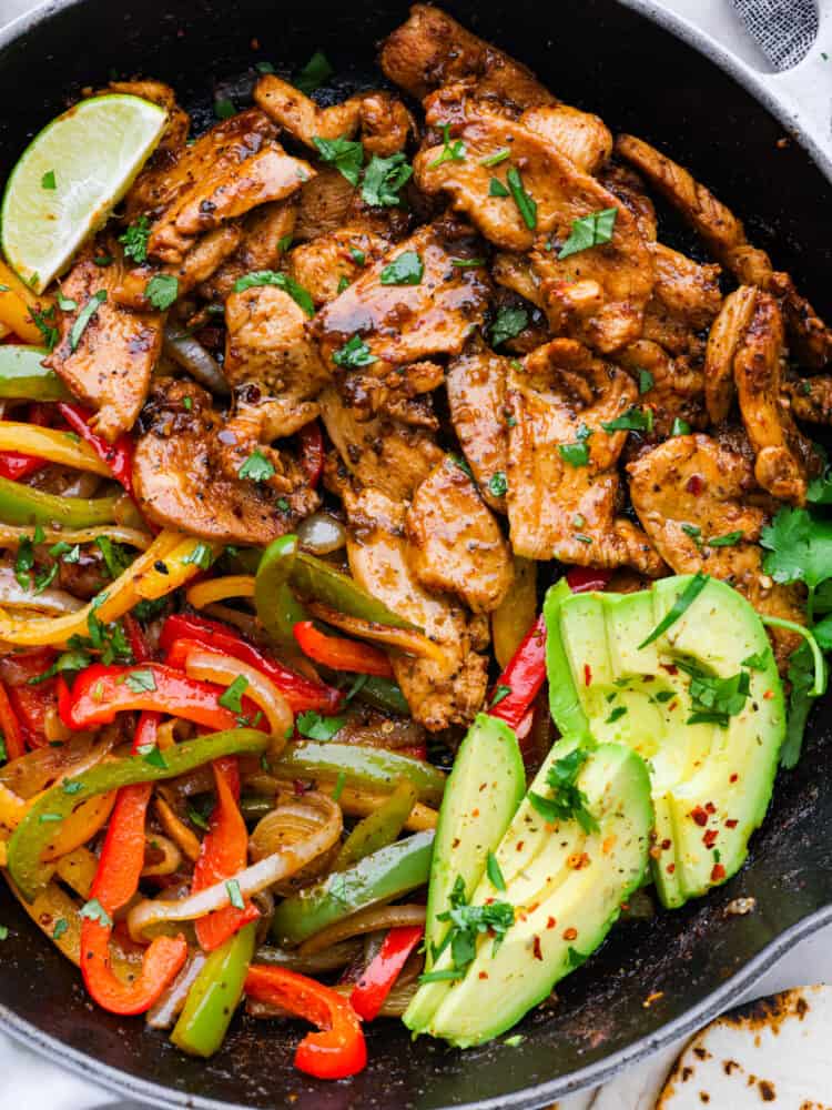 A tropical up on yellow fajitas with fresh avocado.