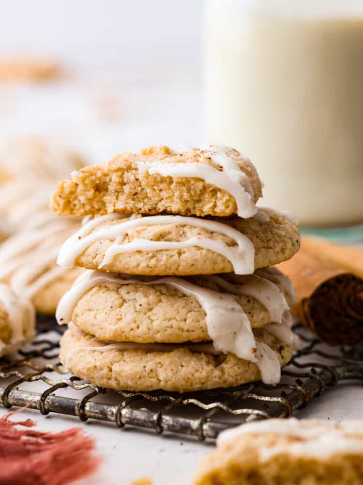 A stack of 4 eggnog cookies stacked on top of each other.