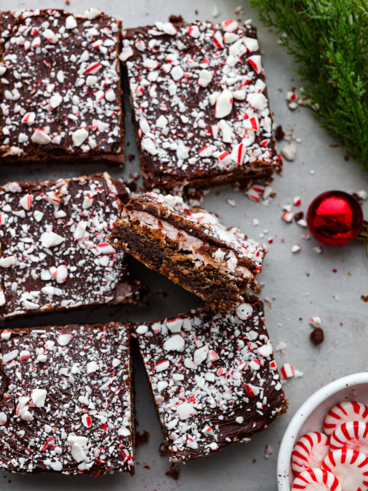 Top-down view of peppermint candy cane brownies cut into squares.