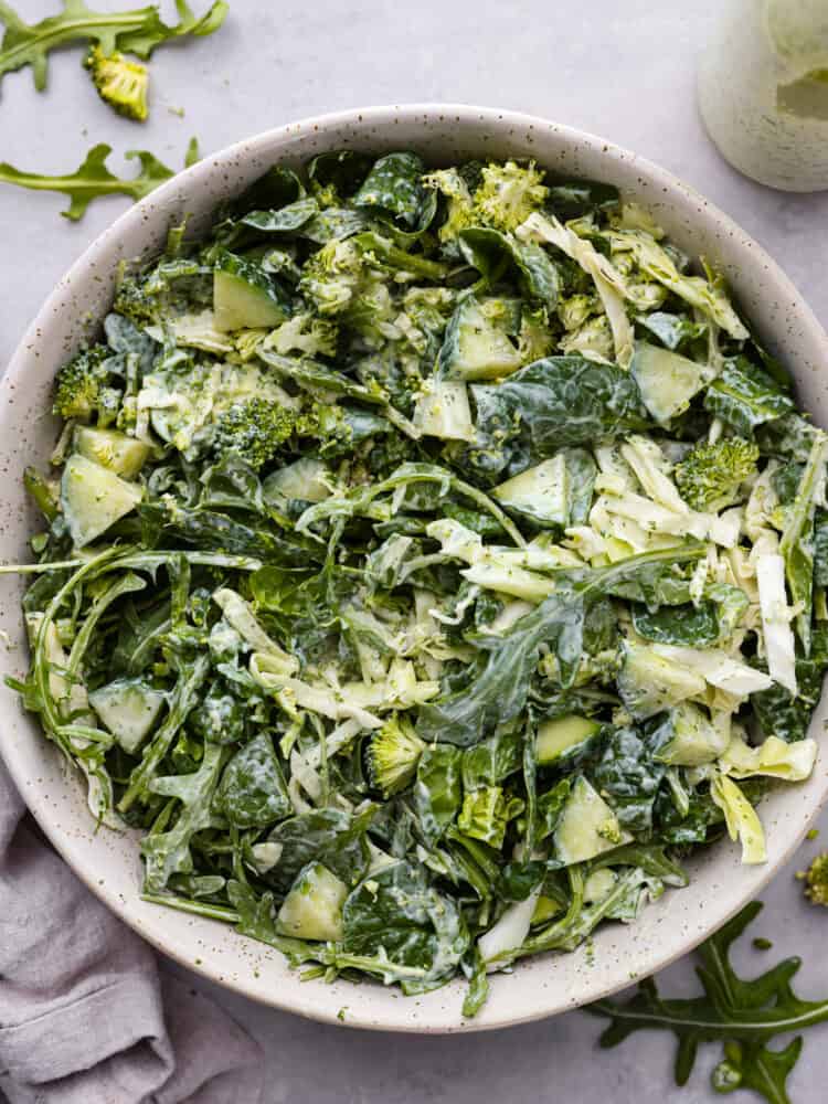 Top-down view of Green Goddess salad in a speckled bowl.