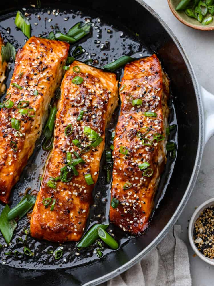 A picture of miso glaze on some salmon in a pan.