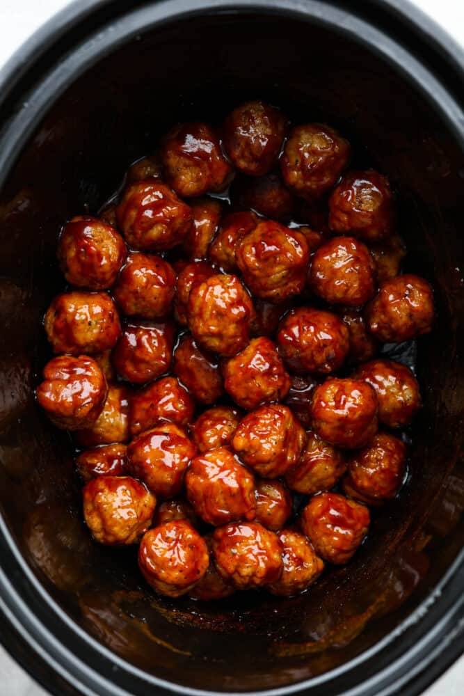 An overhead look at the bbq meatballs in the crock pot.