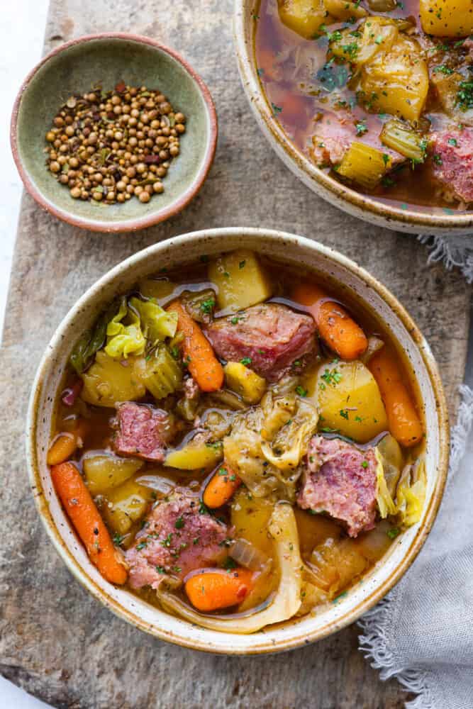 A bowl of slow cooker corned beef and cabbage stew.