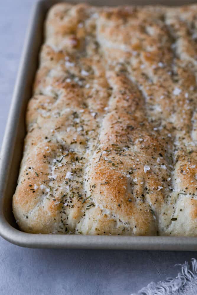A <a href='https://orderondoor.com/product/well-always-have-summer-summer-3-by-jenny-han' target='_blank'></noscript>close</a> up on the focaccia bread.