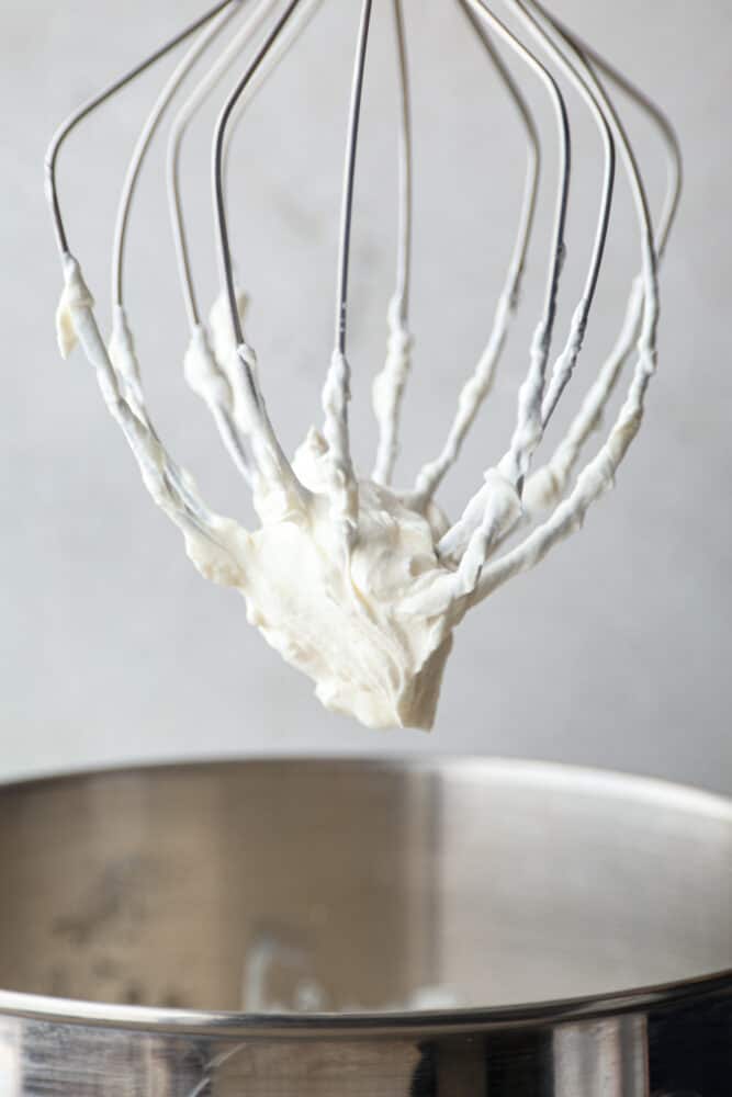 Whipped cream on a whisk.