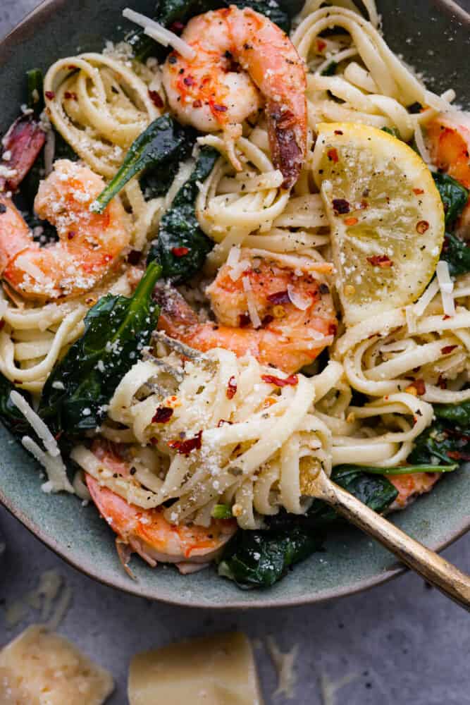 A close up on lemon garlic parmesan shrimp paste in a bowl.