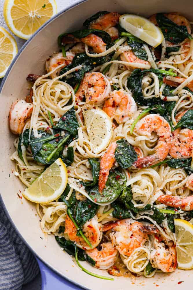 A close up on lemon garlic parmesan shrimp paste in the pan.