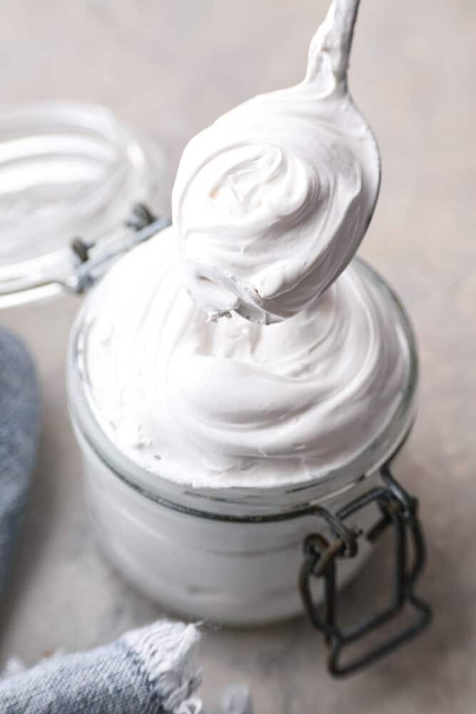 Closeup of a jar filled with marshmallow fluff