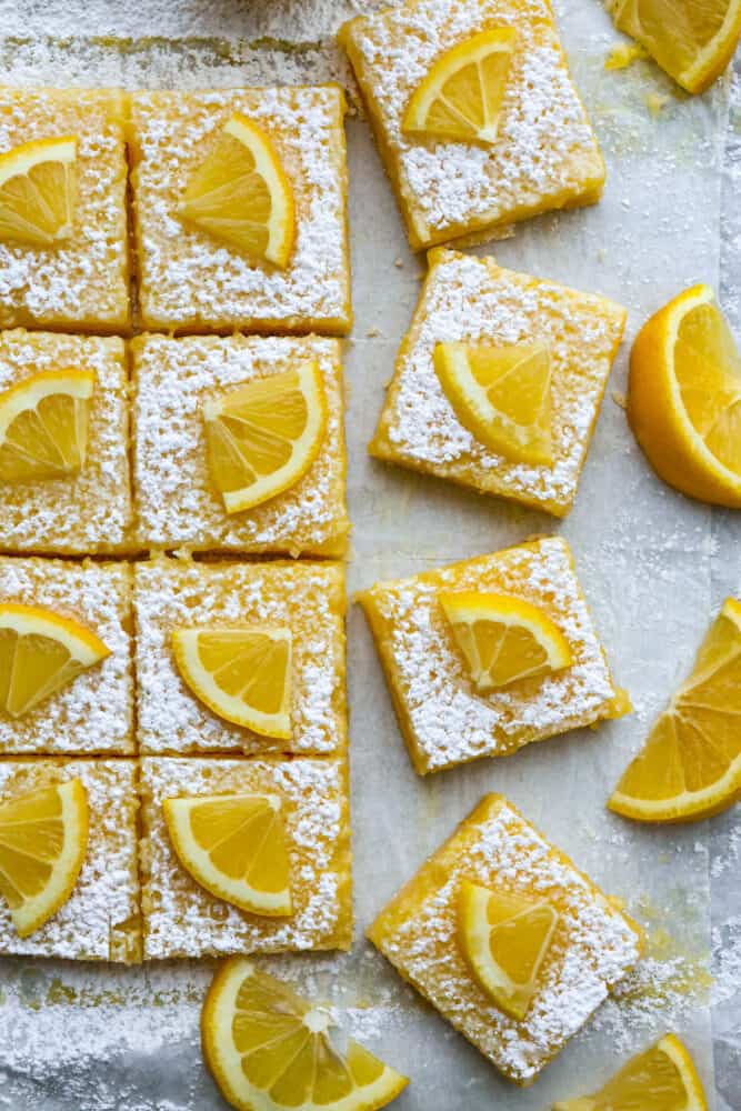 Top-down view of lemon bars cut into squares.