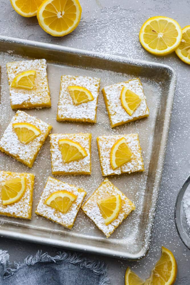 Top-down view of lemon bars in a baking sheet.