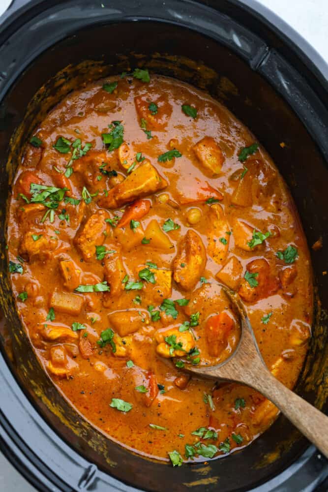 Coconut curry chicken in a slow cooker.