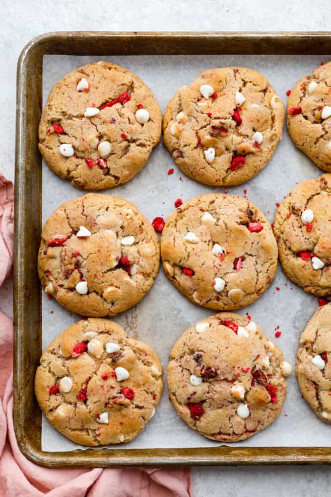 Top-down view of baked strawberry cheesecake cookies.