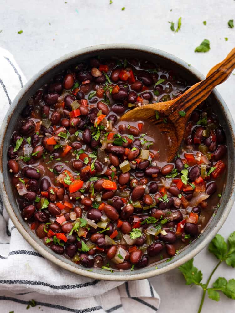 Top-down view of Cuban black beans in a gray bowl.