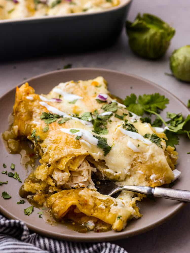 Taking a bite of enchiladas suizas.