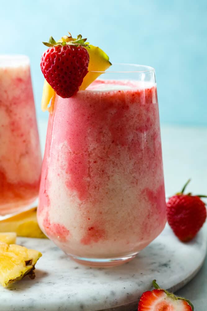 Closeup of a frozen strawberry coconut cocktail.