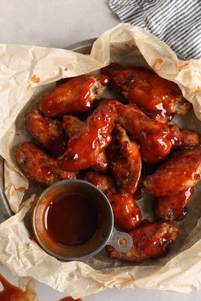 Top-down view of sauced chicken wings.