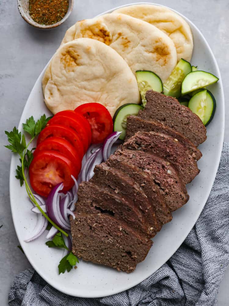 Gyro beef slices served with tomato, onion, cucumber and pita bread.