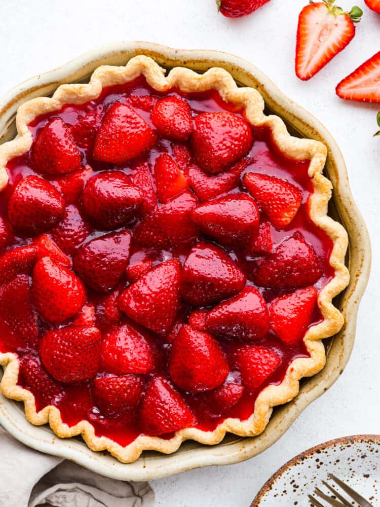 Top-down view of a whole strawberry pie.