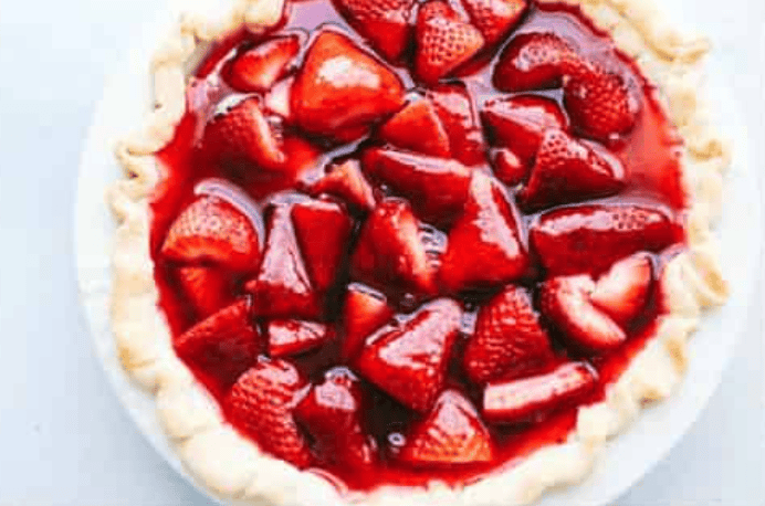 My fresh strawberry pie is one of those desserts that looks gorgeous but is so easy to make. A premade pie crust, juicy, fresh strawberries, and a quick homemade glaze come together to make a glossy, beautiful pie! All of the pie ingredients made and ready to go in the fridge to chill.