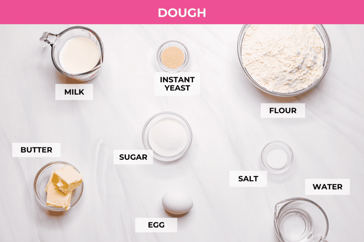 Overhead shot of labeled strawberry cinnamon roll dough ingredients. 