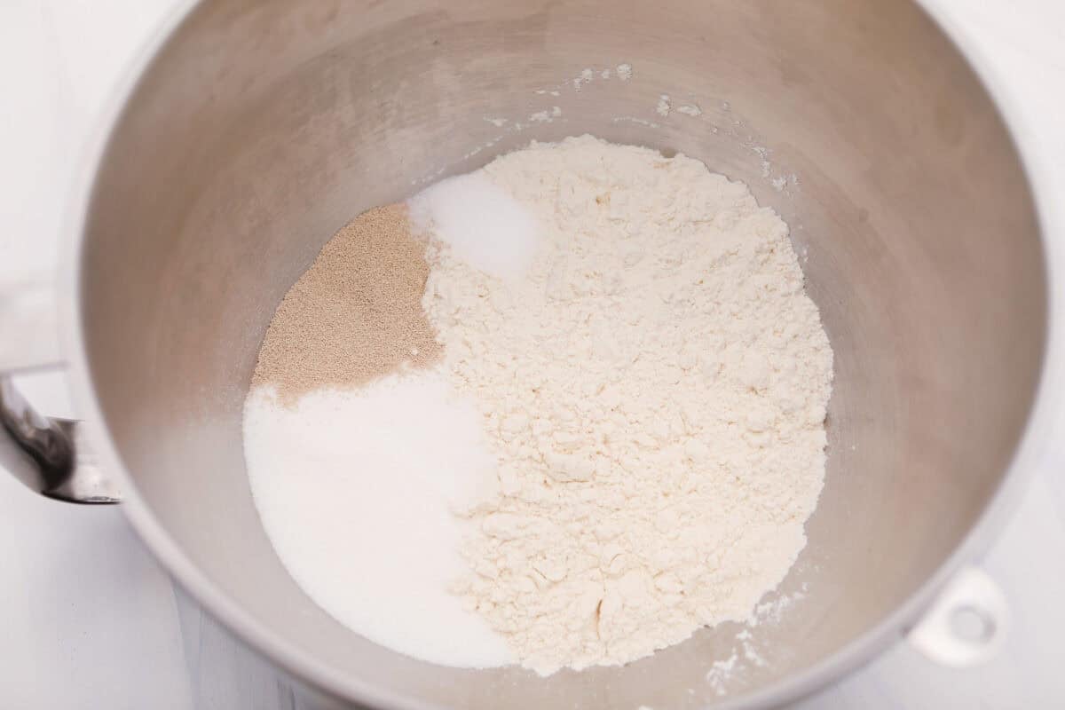 Dry ingredients in the bottom of a stand mixer bowl. 