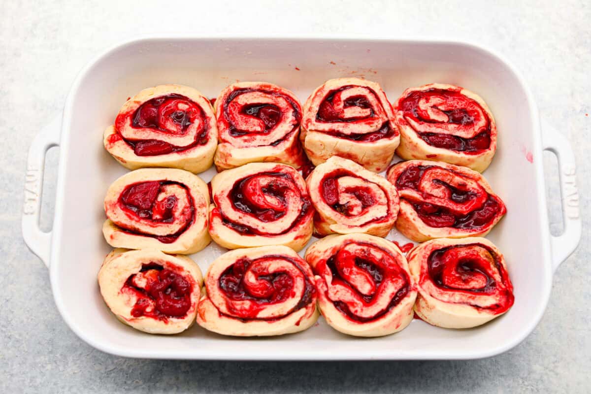 Unbaked cinnamon rolls in a 9x13 baking dish. 