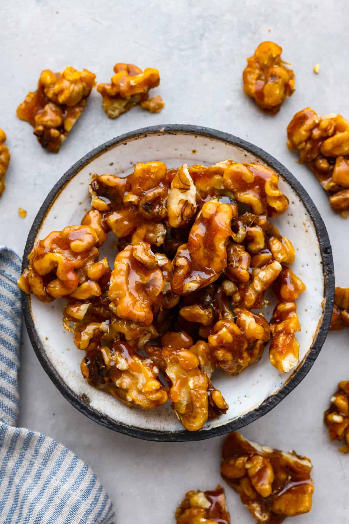 The top view of a bowl of candied walnuts. 