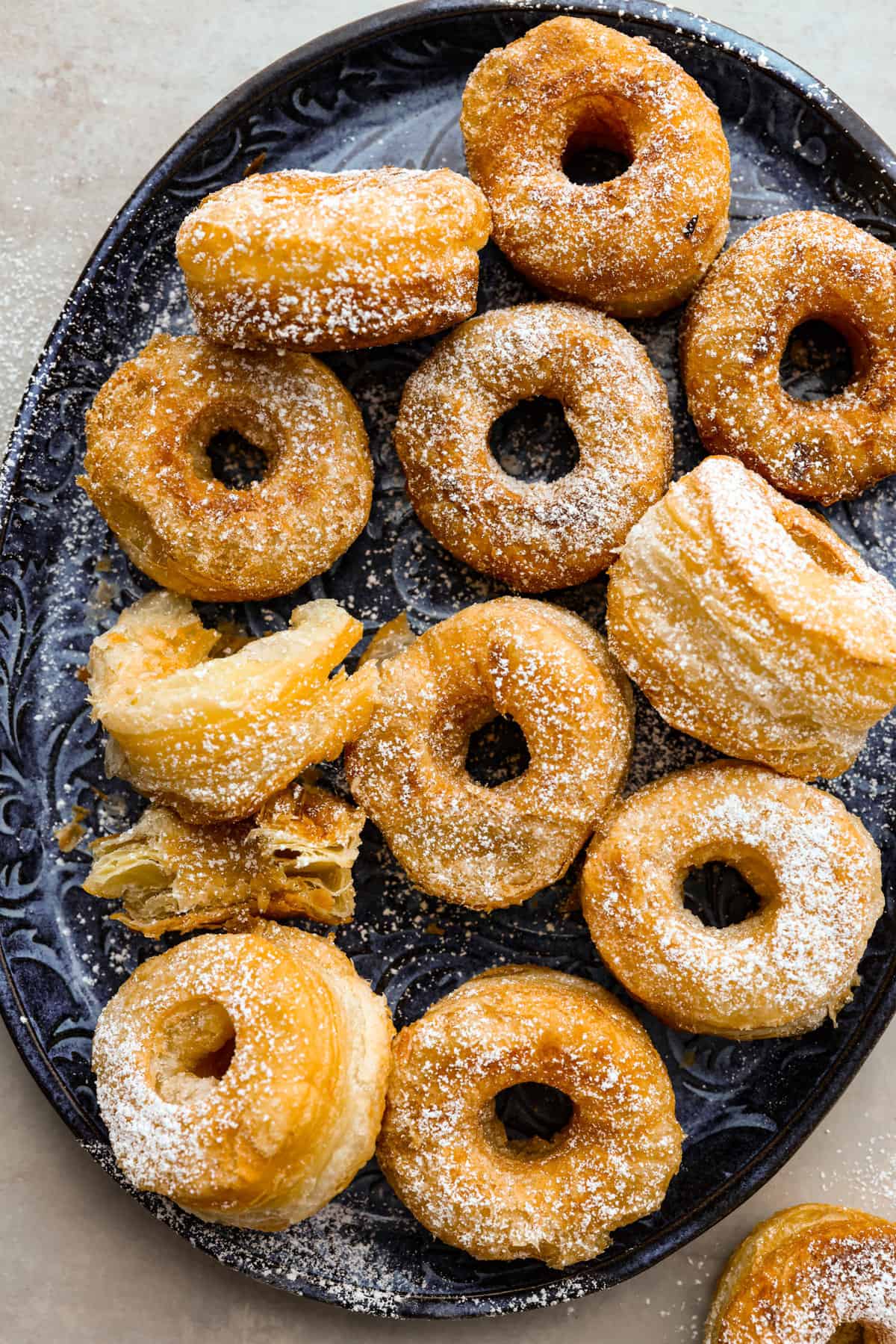 The top view of a platter of cronuts. 