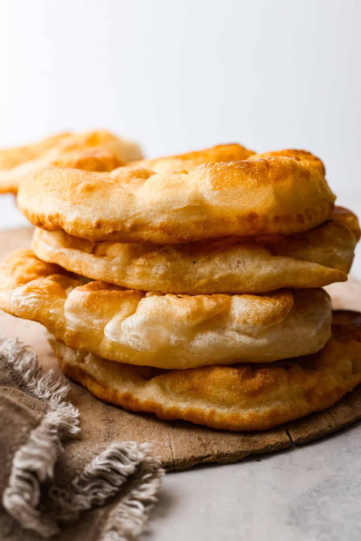 3 pieces of fry bread stacked on top of each other.