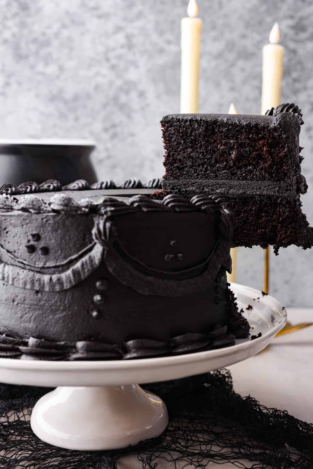 Serving a slice of black velvet cake.