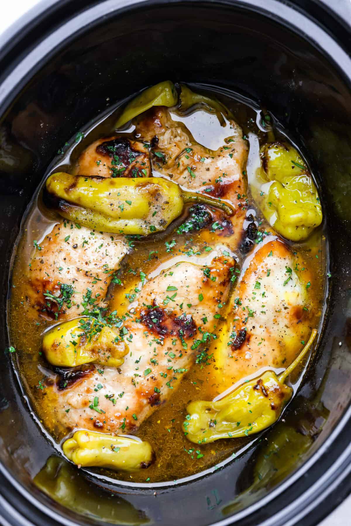 Cooked Mississippi chicken in a crockpot.