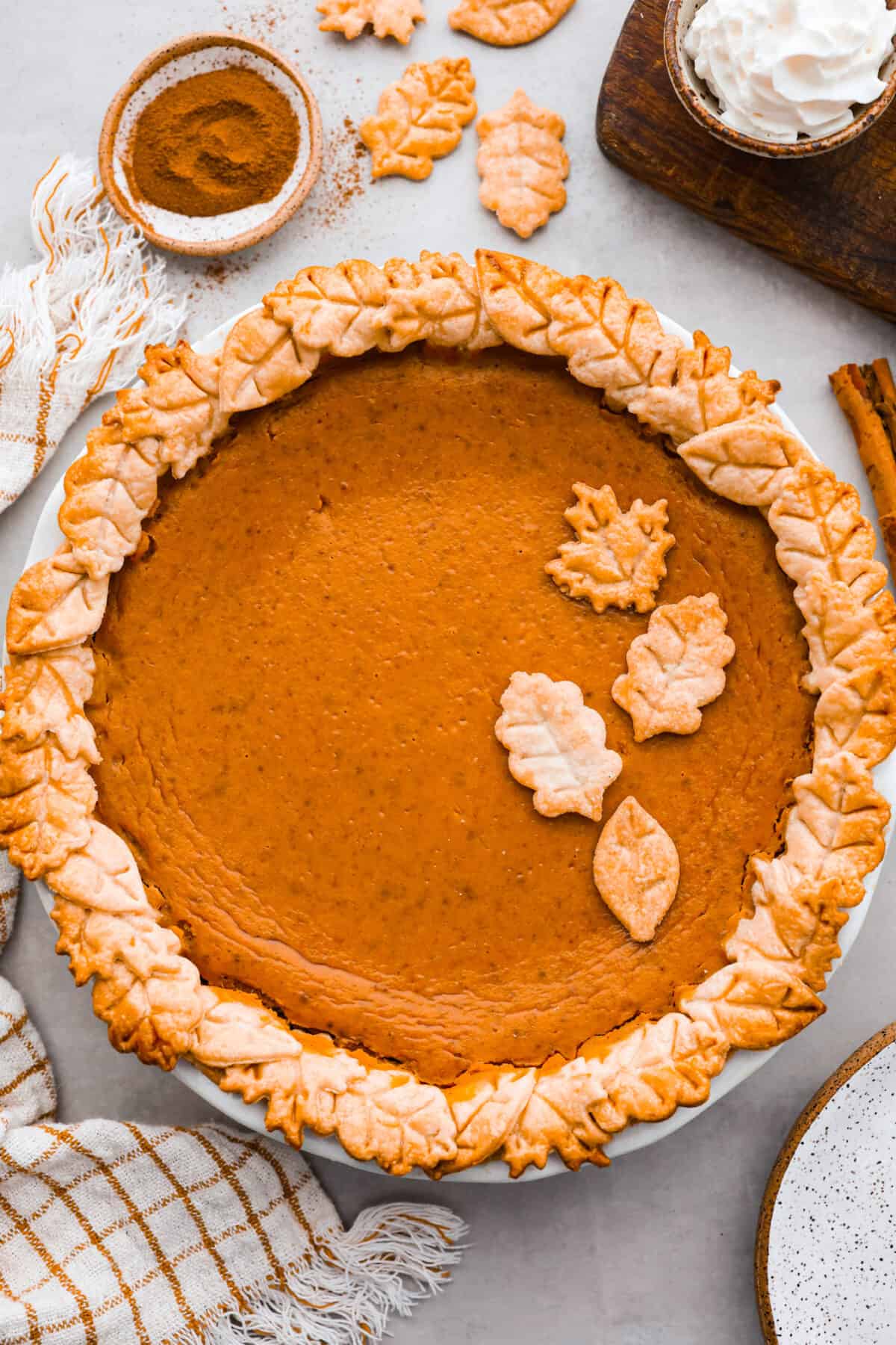 A baked pie, topped with pieces of crust that look like leaves.
